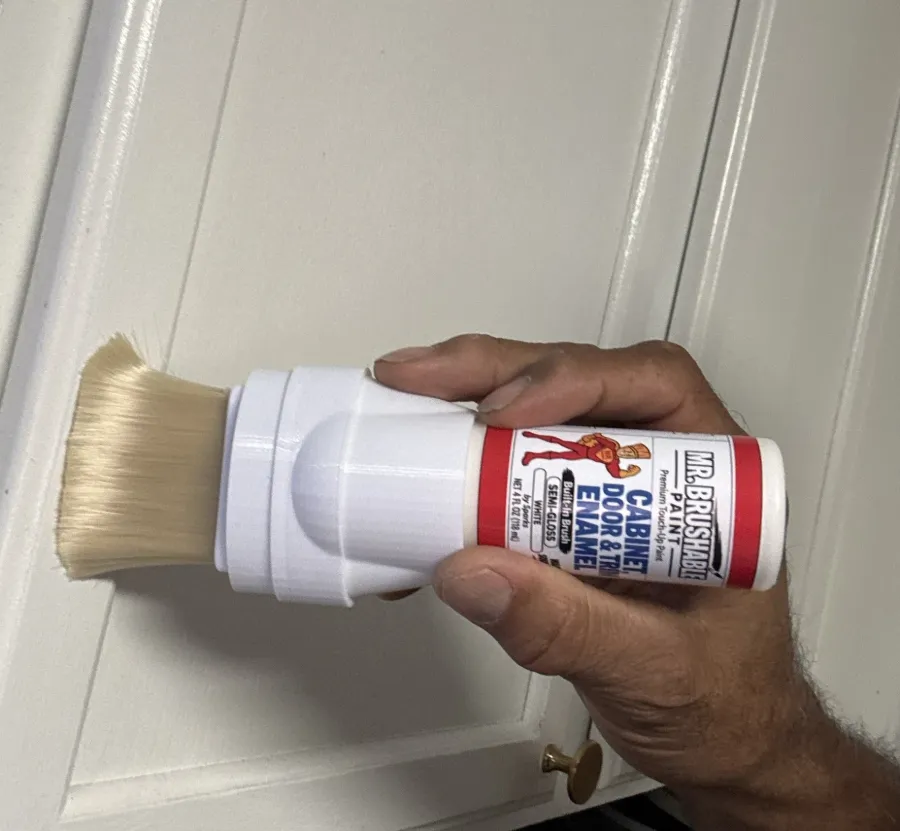 Brushing Mr. Brushable white enamel onto a white cabinet door