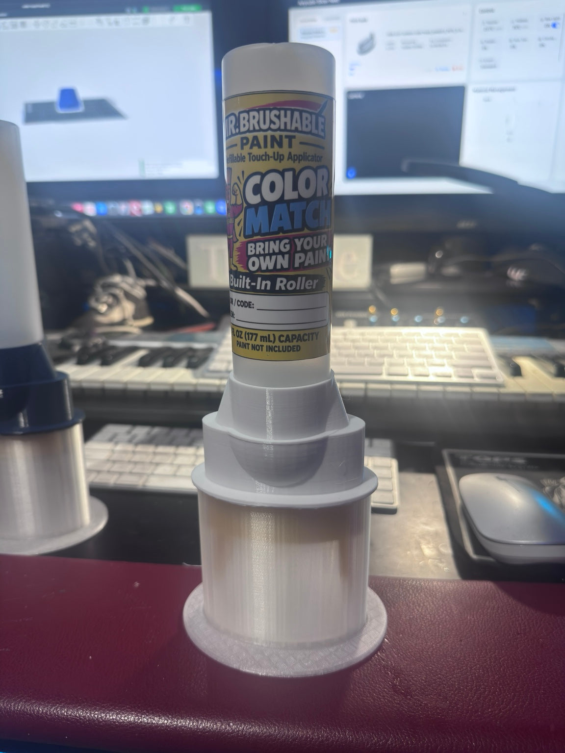 Mr. Brushable color match roller bottle on a desk