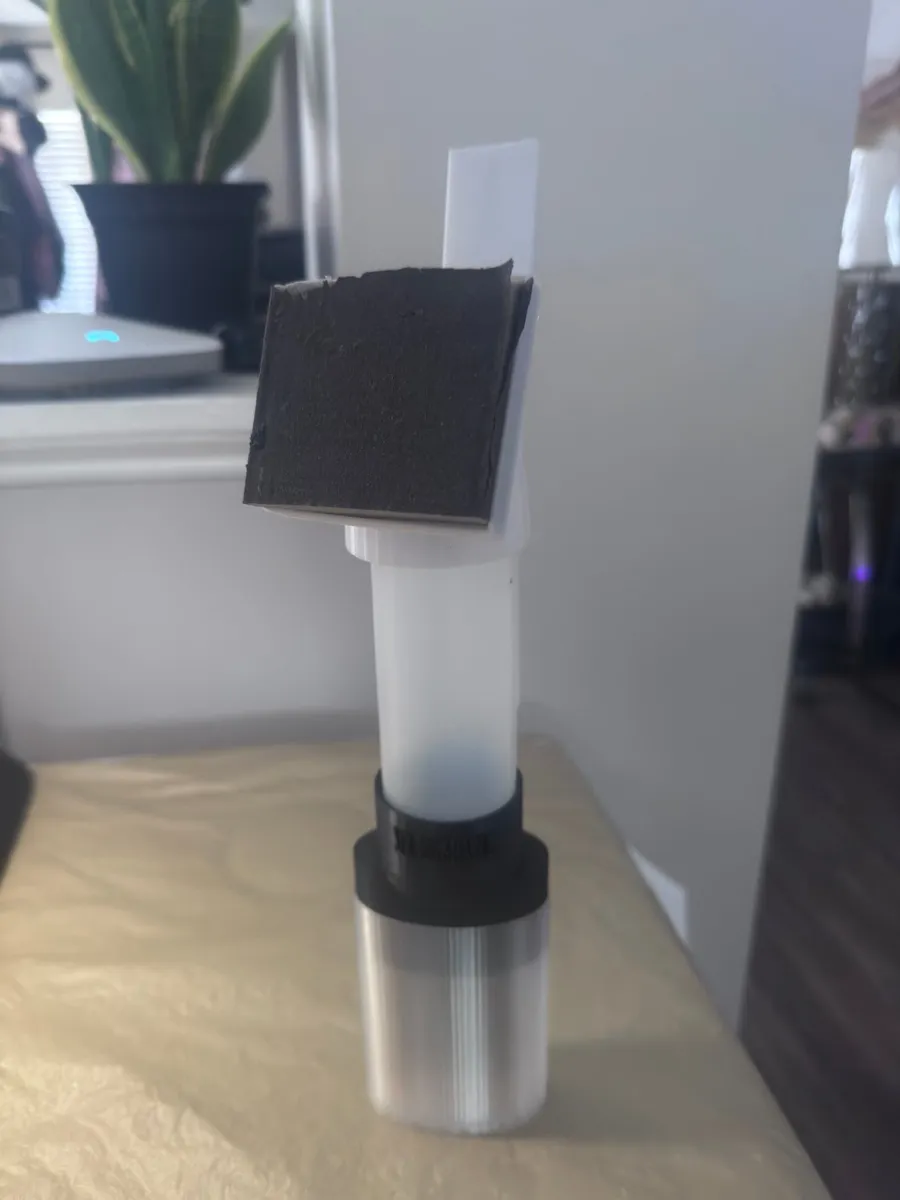 The flip-up sanding head of the Mr. Brushable wall repair kit